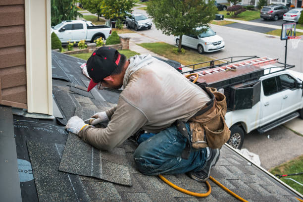 Professional Roofing technician working in Malden, MA